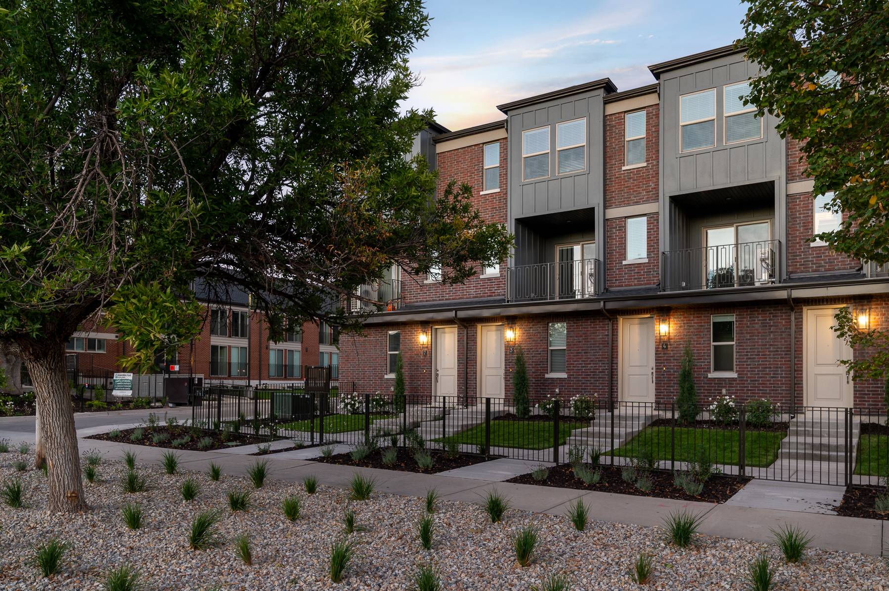 Liberty Wells townhomes with fenced front yards along the street