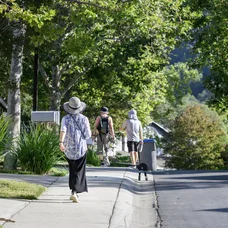 A family walking through their neighborhood