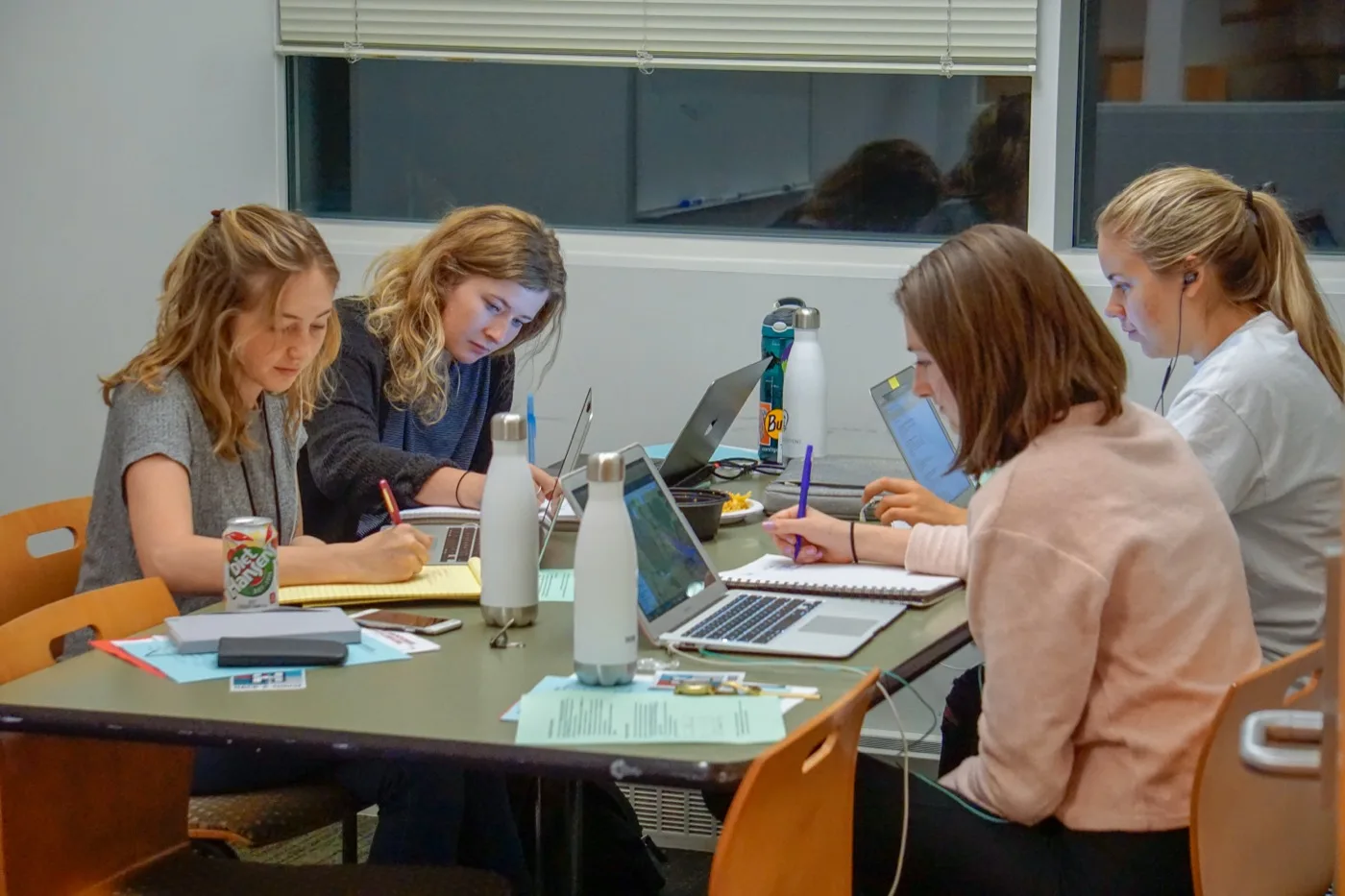 Student Associate Program members collaborating around a table